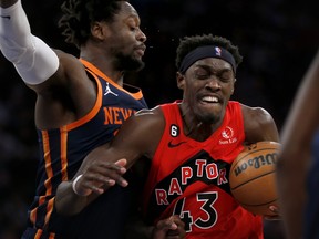 Toronto Raptors forward Pascal Siakam drives past New York Knicks forward Julius Randle, left, during the first half of an NBA basketball game Wednesday, Dec. 21, 2022, in New York.