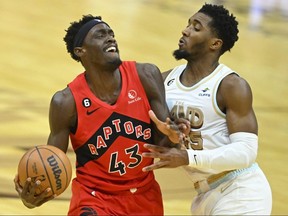 Toronto Raptors forward Pascal Siakam (left) deals with defence from Cleveland Cavaliers guard Donovan Mitchell on Dec. 23, 2022 at Rocket Mortgage FieldHouse in Cleveland.