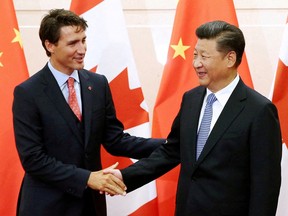FILE PHOTO: Chinese President Xi Jinping (R) shakes hands with Canadian Prime Minister Justin Trudeau ahead of their meeting at the Diaoyutai State Guesthouse in Beijing, China August 31, 2016. REUTERS/Wu Hong/Pool//File Photo