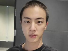 In this photo provided by Weverse, Jin of K-pop band BTS shows off freshly shaved hair on the K-pop social media platform Weverse, which was uploaded Sunday, Dec. 11, 2022, ahead of his upcoming military conscription.