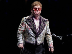 In this Jan. 19, 2022 file photo, Elton John performs as he returns to complete his Farewell Yellow Brick Road Tour since it was postponed due to COVID-19 restrictions in 2020, in New Orleans.