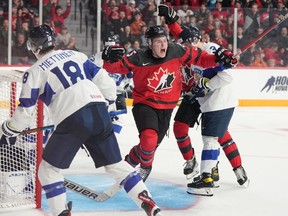 Canada's Brandt Clarke, centre, reacts after scoring during World Junior Hockey Championship pre-tournament action against Finland in Halifax on Friday, December 23, 2022.