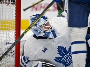 Toronto Maple Leafs goaltender Matt Murray looks up at his teammates as play is stopped during the second period against the Dallas Stars at the American Airlines Center.
