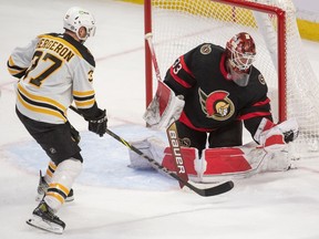 File photo/ Ottawa Senators goalie Cam Talbot (33) makes a save on a shot from Boston Bruins centre Patrice Bergeron (37) in the third period at the Canadian Tire Centre.