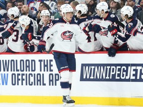 Columbus Blue Jackets forward Patrik Laine (29) is congratulated by his team mates on his goal against the Winnipeg Jets during the second period at Canada Life Centre in Winnipeg on Friday, Dec. 2, 2022.