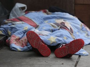 This Toronto Sun file photo shows a homeless person sleeping in the downtown core.