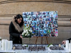 Mourners attend a memorial for the victims of a Ukrainian passenger plane which was shot down in Iran, at Convocation Hall in Toronto, Jan. 12, 2020.