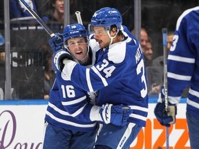 Maple Leafs' Mitch Marner celebrates his goal giving him a franchise-tying 18-game point streak with teammate Auston Matthews against the San Jose Sharks at Scotiabank Arena on Wednesday, Nov. 30, 2022 in Toronto.