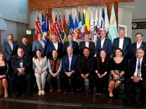 Premiers (back row L-R), Sandy Silver (Yukon), P.J. Akeeagok, (Nunavut), Scott Moe (SK), Doug Ford (Ont),Francois Legault (Que), Dennis King (PEI), Tim Houston (NS), Blaine Higgs (NB), Andrew Furey (NL and Labrador) and (front row L-R), President of Institute for the advancement of Aboriginal Women Lisa Weber, National Chief of Congress of Aboriginal Peoples Elmer St. Pierre, Heather Stefanson (MB), Songhees Nation Chief Ron Sam, John Horgan (BC), Esquimalt Nation Chief Rob Thomas, Caroline Cochrane (NWT), Cassidy Caron (Metis National Council) and Terry Teegee (Assembly of First Nations) gather for a family photo during the summer meeting of the Canada's Premiers at the Songhees Wellness Centre in Victoria, B.C., July 11, 2022.