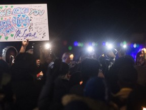 People attend a vigil in memory of Nicous D'Andre Spring in Montreal, Friday, December 30, 2022.