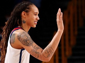 Brittney Griner of the United States congratulates a team mate during their Women's Basketball Gold Medal game against Japan at the Tokyo 2020 Summer Olympics at the Saitama Super Arena in Saitama, Japan, Aug. 8, 2021.