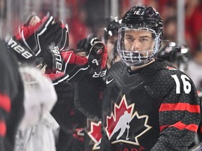 Connor Bedard of Team Canada celebrates his goal with teammates on the bench during the first period against Team Slovakia in the quarterfinals of the 2023 IIHF World Junior Championship at Scotiabank Centre on January 2, 2023 in Halifax, Nova Scotia, Canada.