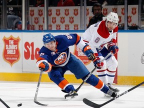 Sebastian Aho (25) of the New York Islanders moves the puck away from Canadiens' Chris Wideman (6) during the second period at the UBS Arena on Saturday, Jan. 14, 2023, in Elmont, N.Y.