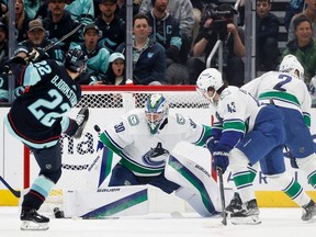 Oliver Bjorkstrand of the Seattle Kraken scores against Spencer Martin of the Vancouver Canucks during the first period at Climate Pledge Arena on Wednesday.