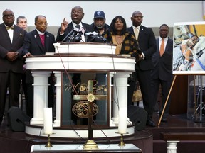 Flanked by the parents of Tyre Nichols and faith and community leaders, civil rights attorney Ben Crump speaks next to a photo of Nichols during a press conference on Jan. 27, 2023 in Memphis, Tenn.