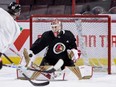 Ottawa Senators goaltender Cam Talbot makes a blocker save during team practice at the Canadian Tire Centre on Jan. 24, 2023.