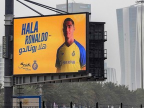 A billboard welcoming Saudi football club al-Nassr's new Portuguese forward Cristiano Ronaldo (#7) is displayed along a road in Saudi Arabia's capital Riyadh on January 3, 2023.