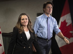 Deputy Prime Minister and Finance Minister Chrystia Freeland, along with Prime Minister Justin Trudeau, arrive at the Hamilton Convention Centre, in Hamilton, Ont., ahead of the Liberal Cabinet retreat, on Monday, January 23, 2023.