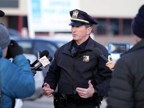 Des Moines Police spokesperson Sgt. Paul Parizek speaks outside the Starts Right Here building, Monday, Jan. 23, 2023, in Des Moines, Iowa. Police say two students were killed and a teacher was injured in a shooting at the school on the edge of the city's downtown.