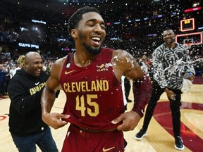 Cavaliers guard Donovan Mitchell (45) celebrates after scoring 71 points to set the franchise record as the Cavs beat the Bulls at Rocket Mortgage FieldHouse in Cleveland, Monday, Jan. 2, 2023.