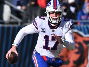Buffalo Bills quarterback Josh Allen runs out of the pocket in the first half against the Chicago Bears at Soldier Field in Chicago, Dec. 24, 2022.