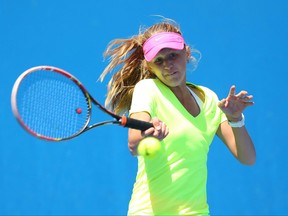 Katherine Sebov of Canada in action in her match against Petra Hule of Australia during the Australian Open 2015 Junior Championships at Melbourne Park on January 25, 2015 in Melbourne, Australia.