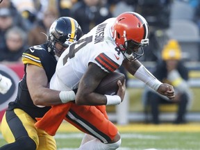 Cleveland Browns quarterback Deshaun Watson (4) is tackled by Pittsburgh Steelers linebacker Alex Highsmith (56) during the fourth quarter at Acrisure Stadium.