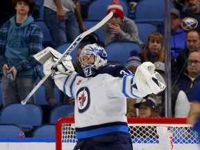 Winnipeg Jets goaltender Connor Hellebuyck reacts after his team beat the Buffalo Sabres at KeyBank Center on Jan. 12, 2023.