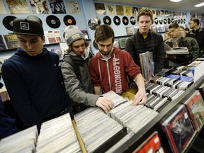 Music fans search through the records at Vertigo Records in Ottawa, April 19, 2014.