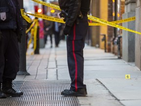Toronto Police attend the scene after an elderly woman was killed inn assault on Yonge St. north of King St. in Toronto on Friday, January 20, 2023.