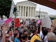 Abortion rights campaigners participate in a demonstration following the leaked Supreme Court opinion suggesting the possibility of overturning the Roe v. Wade abortion rights decision, in Washington, D.C., Saturday, May 14, 2022.