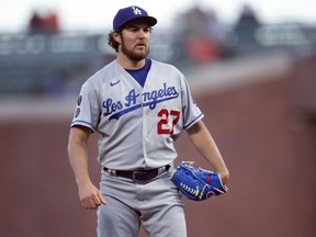 Dodgers pitcher Trevor Bauer pauses while working against the Giants during the fourth inning of a game in San Francisco, May 21, 2021.