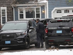 Duxbury Police work at the scene where two children were found dead and an infant injured, Wednesday, Jan. 25, 2023, in Duxbury, Mass.