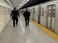 Toronto Police Consts. Greg Henkenhaf and Dave Donaldson on patrol at Spadina TTC station on Thursday, Jan. 26, 2023.