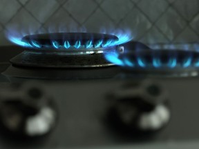 In this photo illustration a gas flame burns on a gas stove top on Aug. 19, 2022 in Berlin, Germany.