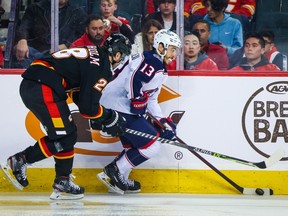 Columbus Blue Jackets left winger Johnny Gaudreau (13) controls the puck against the Calgary Flames during the third period at Scotiabank Saddledome on Jan 23, 2023.