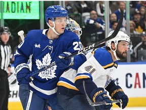 Toronto Maple Leafs forward Dryden Hunt battles for position with St. Louis Blues defenseman Robert Bortuzzo in the first period at Scotiabank Arena.