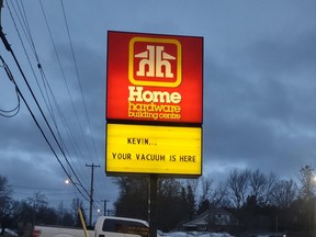 Outdoor Home Hardware sign that reads 'Kevin... your vacuum is here'