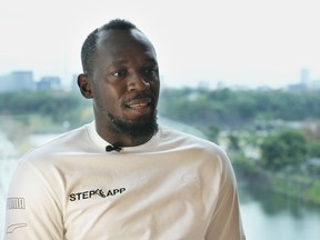 Retired Jamaican sprinter Usain Bolt speaks during an interview in Tokyo, Dec. 1, 2022.