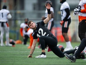 Quarterback Nathan Rourke, stretching during a Lions practice in Surrey last fall, has worked out for more than half a dozen NFL teams in the last few weeks.