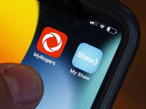 Rogers and Shaw apps are pictured on a cellphone in Ottawa on Monday, May 9, 2022.