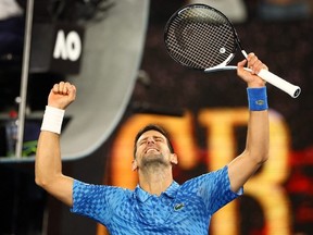 Serbia's Novak Djokovic celebrates winning his first round match against Spain's Roberto Carballes Baena.