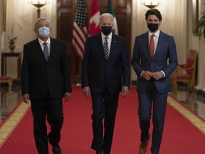 Canadian Prime Minister Justin Trudeau, United States President Joe Biden and Mexican President Andres Manuel Lopez Obrador walk to a meeting at the North American Leaders' Summit in Washington, D.C., on Nov. 18, 2021.