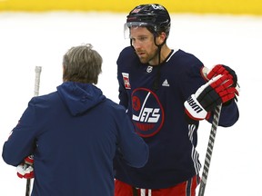 Blake Wheeler in conversation with head coach Rick Bowness during Winnipeg Jets practice.
