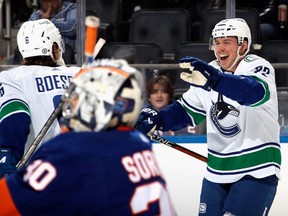 Anthony Beauvillier #72 of the Vancouver Canucks scores a third period goal against the New York Islanders at UBS Arena on February 09, 2023 in Elmont, New York.