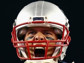 Tom Brady of the New England Patriots yells as he runs onto the field before the game against the Kansas City Chiefs at Gillette Stadium on September 7, 2017 in Foxboro, Massachusetts.