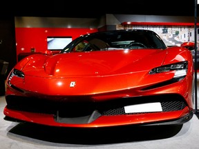 A Ferrari SF90 Stradale hybrid sports car is seen during a media preview at the Auto Zurich Car Show in Zurich, Switzerland November 3, 2021.