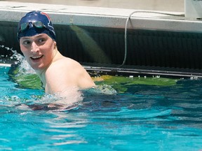 University of Pennsylvania swimmer Lia Thomas smiles after winning the 100 yard freestyle during the 2022 Ivy League Womens Swimming and Diving Championships at Blodgett Pool on Feb. 19, 2022 in Cambridge, Mass.