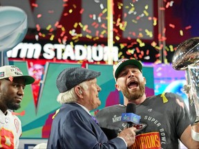 FOX Sports personality Terry Bradshaw interviews Kansas City Chiefs tight end Travis Kelce (87) after he won Super Bowl LVII against the Philadelphia Eagles at State Farm Stadium.