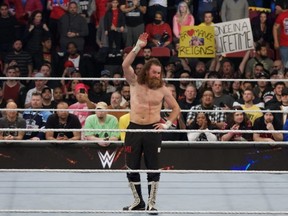An emotional Sami Zayn acknowledges his hometown Montreal crowd after his loss to Undisputed WWE Universal champion Roman Reigns at Elimination Chamber at the Bell Centre in Montreal on Saturday night.